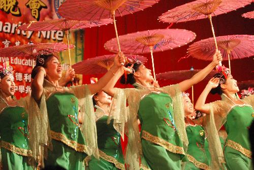 Actresses from the Overseas Chinese Union Art Troupe of Yunan Province perform during a celebration of the Chinese lunar New Year in Kota Kinabalu, capital of Malaysia's Sabah State, on Feb. 18, 2010. 