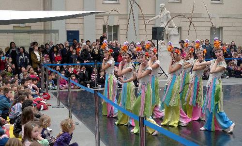 Chinese dancers perform at the National Maritime Museum in Greenwich of London, Feb. 18, 2010. A group of 32 professional performers from southwest China's Sichuan Province held the performance Thursday to celebrate the Chinese Spring Festival. The performance, featuring traditional dances, acrobatics and Sichuan opera, amazed hundreds of local audiences. 