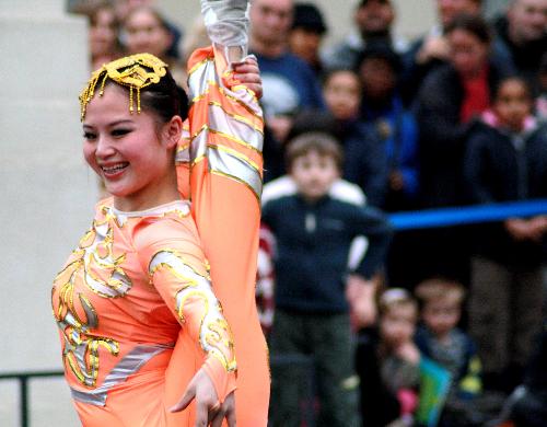 A Chinese acrobat performs at the National Maritime Museum in Greenwich of London, Feb. 18, 2010. A group of 32 professional performers from southwest China's Sichuan Province held the performance Thursday to celebrate the Chinese Spring Festival. The performance, featuring traditional dances, acrobatics and Sichuan opera, amazed hundreds of local audiences. 