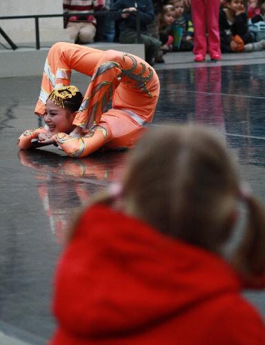 A Chinese acrobat performs at the National Maritime Museum in Greenwich of London, Feb. 18, 2010. A group of 32 professional performers from southwest China's Sichuan Province held the performance Thursday to celebrate the Chinese Spring Festival. The performance, featuring traditional dances, acrobatics and Sichuan opera, amazed hundreds of local audiences. 