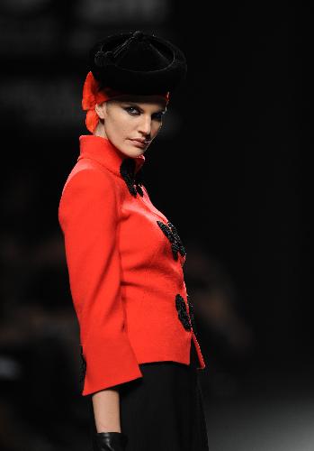 A model displays a creation by designer Elio Berhanyer at Cibeles Madrid Fashion Week in Madrid, capital of Spain, Feb. 19, 2010. 