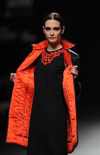 A model displays a creation by designer Elio Berhanyer at Cibeles Madrid Fashion Week in Madrid, capital of Spain, Feb. 19, 2010.