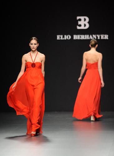 Models present creations by designer Elio Berhanyer at Cibeles Madrid Fashion Week in Madrid, capital of Spain, Feb. 19, 2010. 