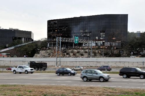 Photo taken on Feb. 18, 2010 shows the office building which was hit by a small aircraft crash in Austin, south U.S. state of Texas. [Chen Ruwei/Xinhua] 
