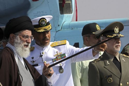 A handout photo shows Iran&apos;s Supreme Leader Ayatollah Ali Khamenei (R) talking to a military commander as he visits the country&apos;s first domestically-made destroyer Jamaran, which was launched in undisclosed waters of the Persian Gulf in south Iran February 19, 2010.[Xinhua]