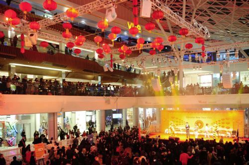 People watch performances during a Chinese New Year Fair at the Westfield Shopping Center in London, February 19, 2010. 