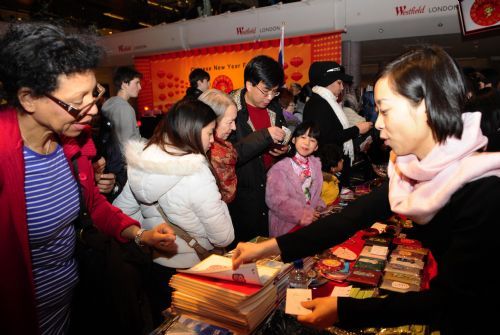 People shop at a Chinese New Year Fair at the Westfield Shopping Center in London, February 19, 2010. 