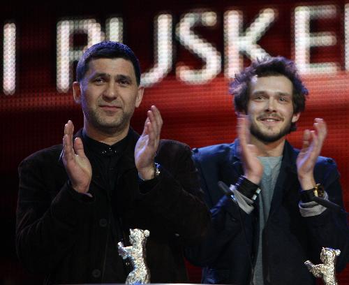 Russian actors Grigory Dobrygin (R) and Sergei Puskepalis applaud after receiving Silver Bears for Best Actor for their roles in 'Kak Ya Provel Etim Letom' (How I Ended This Summer) during the awards ceremony of the 60th Berlinale International Film Festival in Berlin on Feb. 20, 2010.