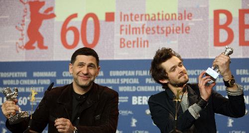 Russian actors Grigory Dobrygin (R) and Sergei Puskepalis applaud after receiving Silver Bears for Best Actor for their roles in 'Kak Ya Provel Etim Letom' (How I Ended This Summer) during the awards ceremony of the 60th Berlinale International Film Festival in Berlin on Feb. 20, 2010.