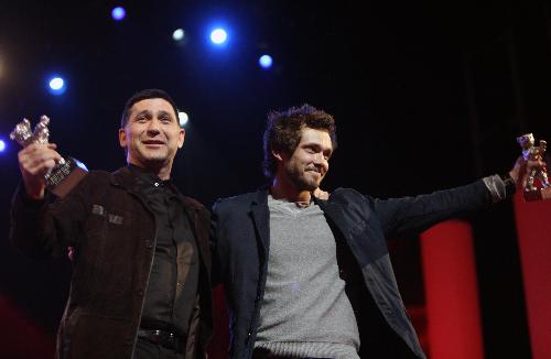 Russian actors Grigory Dobrygin (R) and Sergei Puskepalis applaud after receiving Silver Bears for Best Actor for their roles in 'Kak Ya Provel Etim Letom' (How I Ended This Summer) during the awards ceremony of the 60th Berlinale International Film Festival in Berlin on Feb. 20, 2010. 