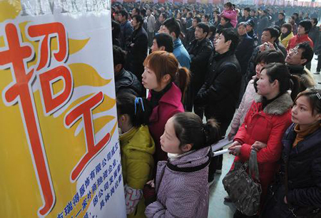 Migrant workers at a job fair in Wuhu, Anhui Province, on Feb. 20, 2010. Migrant workers go for job opportunities after spending the Spring Festival holidays in their hometowns. [Xinhua photo]