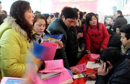 Migrant workers at a job fair in Wuhu, Anhui Province, on Feb. 20, 2010. Migrant workers go for job opportunities after spending the Spring Festival holidays in their hometowns.[Xinhua photo] 