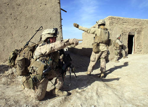 U.S. Marines from Bravo Company of the 1st Battalion, 6th Marines, gesture during an operation in the town of Marjah, in Nad Ali district of Helmand province February 17, 2010. [Xinhua] 