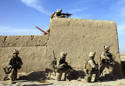 U.S. Marines from Bravo Company of the 1st Battalion, 6th Marines, take up positions during an operation in the town of Marjah, in Nad Ali district of Helmand province February 17, 2010. [Xinhua] 