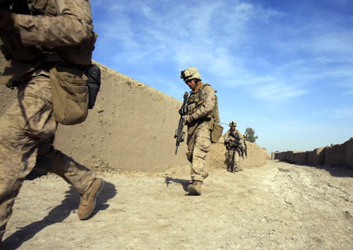 U.S. Marines from Bravo Company of the 1st Battalion, 6th Marines, run during an operation in the town of Marjah, in Nad Ali district of Helmand province February 17, 2010. [Xinhua] 