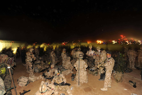 British soldiers from the First Battalion The Royal Welsh mobilise for Operation Moshtarak, a combined force of 15,000 troops launching major assaults on Taliban strongholds in Helmand Province, at Camp Bastion, Afghanistan February 13, 2010. [Xinhua] 