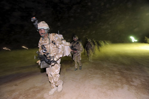 British soldiers from the First Battalion The Royal Welsh mobilise for Operation Moshtarak, a combined force of 15,000 troops launching major assaults on Taliban strongholds in Helmand Province, at Camp Bastion, Afghanistan February 13, 2010. [Xinhua] 