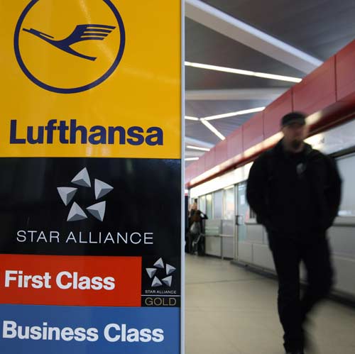 A man walks past a billboard of Lufthansa airline at the Tegel airport in Berlin, capital of Germany, Feb. 22, 2010. Two-thirds of the flights of Europe&apos;s largest airline Lufthansa are expected to be canceled between Feb. 22 and Feb. 25 because of the pilot strikes from Monday to Thursday to press their demands for job security, pay rises and a management promise not to outsource operations to worse-paid subsidiaries. [Xinhua] 