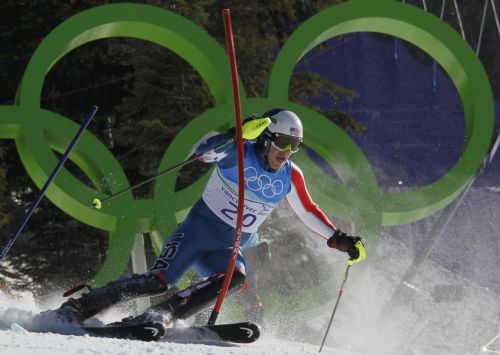 Bode Miller of the U.S. clears a gate during the Slalom run of the men's Alpine Skiing Super Combined event at the Vancouver 2010 Winter Olympics in Whistler, British Columbia, February 21, 2010. 
