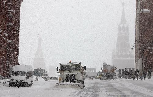 Snow sweepers clear snow at the Red Square in Moscow, capital of Russia, Feb. 22, 2010. Moscow has been blanketed with some 45.4 cm of snow over the last four days in a rare case in decades, the Moscow Weather Service said on Monday. [Xinhua]