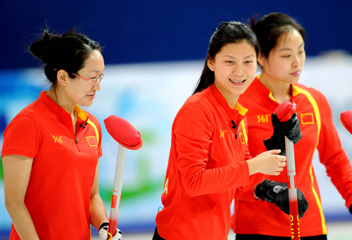 China's Zhou Yan, Liu Yin and Yue Qingshuang (from L to R) react during the women's curling round robin match against Canada at the 2010 Winter Olympic Games in Vancouver, Canada, Feb. 21, 2010. (Xinhua/Chen Kai)