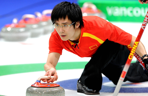 China's Zang Jialiang throws the stone during the men's curling round robin match against the United States at the 2010 Winter Olympic Games in Vancouver, Canada, Feb. 22, 2010. China won 11-5. (Xinhua/Chen Kai)