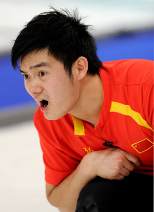 China's Xu Xiaoming cheers for his teammates during the men's curling round robin match against the United States at the 2010 Winter Olympic Games in Vancouver, Canada, Feb. 22, 2010. (Xinhua/Chen Kai)