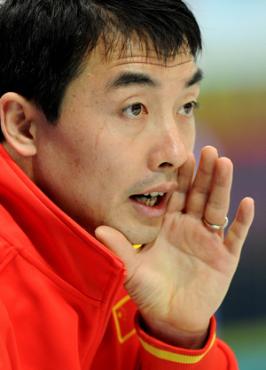 China's Li Hongchen cheers for his teammates during the men's curling round robin match against the United States at the 2010 Winter Olympic Games in Vancouver, Canada, Feb. 22, 2010. (Xinhua/Chen Kai)