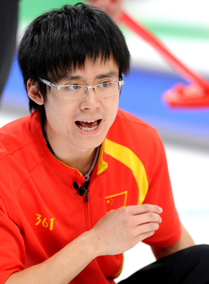 China's Zang Jialiang cheers for his teammates during the men's curling round robin match against the United States at the 2010 Winter Olympic Games in Vancouver, Canada, Feb. 22, 2010. (Xinhua/Chen Kai)
