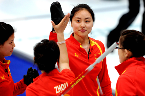 China's Liu Yin, Zhou Yan, Yue Qingshuang and Wang Bingyu (from L to R) react during the women's curling round robin match against Canada at the 2010 Winter Olympic Games in Vancouver, Canada, Feb. 21, 2010. (Xinhua/Chen Kai)