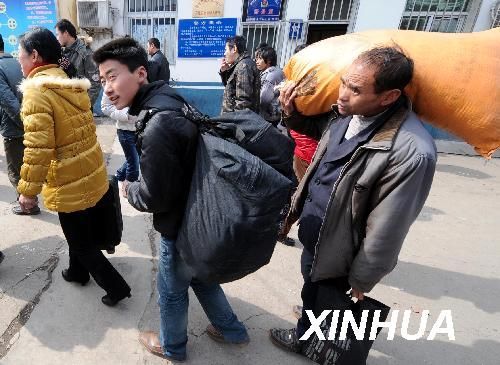  Migrant workers look for opportunities in a job fair in Nanjing, Jiangsu Province, on February 19, 2010. 