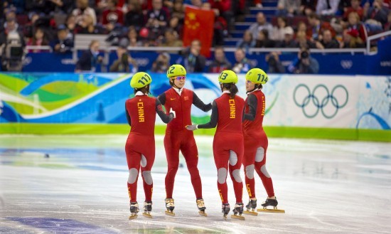 China won the women's 3,000m short track speed skating gold medal with a world record at the Vancouver Olympic Winter Games in Vancouver on Wednesday. China clocked in 4:06.610 for the top honor, Canada got the silver and the United States finished third. South Korea was disqualified in the final.