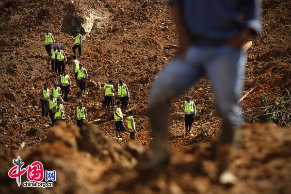 February 25: Rescuers search for landslide victims as the search continues for people buried under a landslide on on February 25, 2010 in Dewata, West Java, Indonesia. Approximately 35 people are still missing after heavy rain caused the landslide to cover houses, factories and offices at a tea plantation. [CFP]