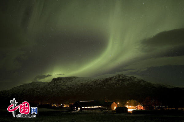 Aurora borealis dancing over the farm Parken Gard in Langfjordbotn, Alta, Finnmark, Northern Norway, in November 2009. These incredible pictures of the Northern Lights are the results of one woman&apos;s gruelling journey through wind and snow on a quest to capture the infamous phenomenon in all its heavenly glory. [CFP]