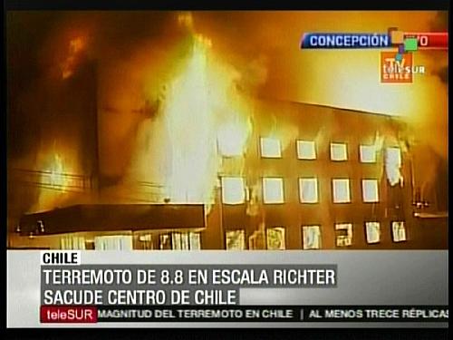 A TV grab from Telesur shows an image of a burning building in Concepcion after a huge 8.8-magnitude earthquake rocked Chile, killing at least 78 people, toppling buildings and triggering a tsunami threatening the Pacific rim of fire, officials have said. (Xinhua/AFP Photo)