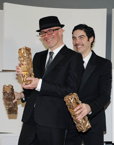 French director Jacques Audiard (L) and French actor Tahar Rahim pose with their Best Director, Best Actor and Best Newcomer awards for the film 'Un Prophete' (A Prophet) during the 35th film Cesar Awards ceremony in Paris February 27, 2010. Audiard's powerful prison drama 'Un Prophete' (A Prophet) swept the board at the 'Cesar' awards on Saturday, picking up the best film, best actor and best director prizes at France's annual version of the Oscars. 