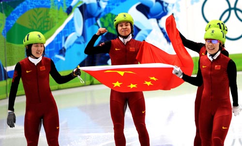 China's Sun Linlin (L), Wang Meng (2nd L), Zhou Yang (front in R) and Zhang Hui celebrate after the women's 3000m relay final of short track speed skating at the 2010 Winter Olympic Games in Vancouver, Canada, Feb. 24, 2010. China's team won the title of the event with a world-record-breaking time 4:06.610. (Xinhua/Shen Hong)