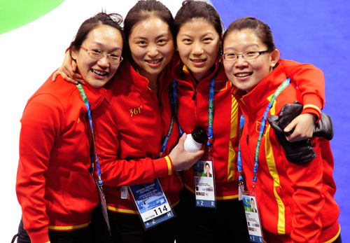 China's Zhou Yan, Yue Qingshuang, Liu Yin and Wang Bingyu (from L to R) celebrate after the women's curling bronze medal match with Switzerland at the 2010 Winter Olympic Games in Vancouver, Canada, Feb. 26, 2010. 