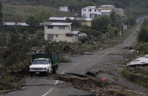 A truck travels on a damaged road in earthquake-and-tsunami-devastated Dichato town, some 30 kilometers north of Concepcion, Chile, March 1, 2010. The death toll from the 8.8-magnitude earthquake that hit Chile early Saturday has reached 723, the Chilean government said on Monday. More than 500 people were injured and at least 19 people are still unaccounted for, the National Emergency Office (Onemi) said.[Victor Rojas/Xinhua]