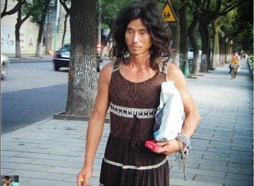 An undated photograph of a homeless man, nicknamed Brother Sharp for his good looks and sharp dress sense, wandering the streets of Ningbo, Zhejiang province, was recently posted on the Internet. He is one of the most talked about personalities in Chinese cyberspace today. [www.tianya.cn]