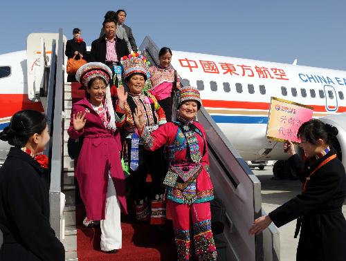 Deputies to the Third Session of the 11th National People's Congress (NPC) from southwest China's Yunnan Province arrive in Beijing, capital of China, March 2, 2010. The Third Session of the 11th NPC is scheduled to open on March 5. [Yang Zongyou/Xinhua]