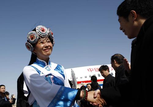 Deputies to the Third Session of the 11th National People's Congress (NPC) from southwest China's Yunnan Province arrive in Beijing, capital of China, March 2, 2010. The Third Session of the 11th NPC is scheduled to open on March 5. [Fei Maohua/Xinhua]