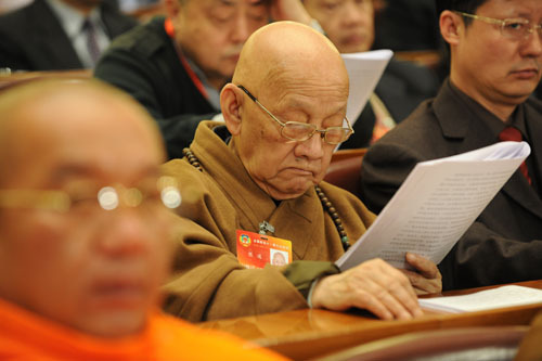 Members of the 11th National Committee of the Chinese People's Political Consultative Conference (CPPCC) attend the opening meeting of the Third Session of the 11th CPPCC National Committee at the Great Hall of the People in Beijing, capital of China, March 3, 2010.