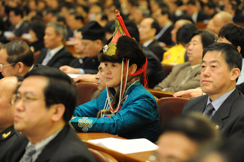 Members of the 11th National Committee of the Chinese People's Political Consultative Conference (CPPCC) attend the opening meeting of the Third Session of the 11th CPPCC National Committee at the Great Hall of the People in Beijing, capital of China, March 3, 2010. 