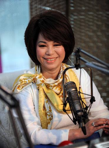 Singer Tsai Chin from southeast China's Taiwan talks in an interview with a local radio station in Changsha, capital city of central-south China's Hunan Province, March 3, 2010. Tsai will hold her solo cencert on April 10 in Changsha.