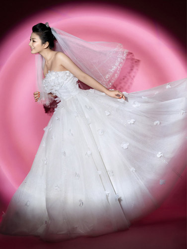 Chinese actress Huang Yi poses for a photo spread that is featured in the magazine 'Modern Bride'. 