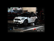 A Mini Cooper S is displayed at the exhibition stand of Audi during the 80th Geneva Motor Show at the Palexpo in Geneva March 2, 2010. [Sina.com.cn]