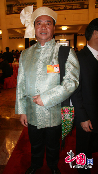 An NPC deputy from the Dai people, one of China&apos;s 56 ethnic groups, attends the National People&apos;s Congress at the Great Hall of the People in Beijing, March 5, 2010. [Li Shen/China.org.cn]