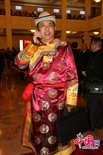 An ethnic minority deputy attends the National People&apos;s Congress at the Great Hall of the People in Beijing, March 5, 2010. [Li Shen/China.org.cn]