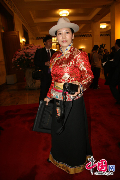 An ethnic minority deputy attends the National People&apos;s Congress at the Great Hall of the People in Beijing, March 5, 2010. [Li Shen/China.org.cn]